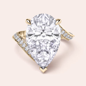 Exquisite pear-shaped diamond ring in 14K/18K gold or platinum, adorned with halo diamond accents for an elegant touch.