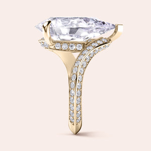Exquisite pear-shaped diamond ring in 14K/18K gold or platinum, adorned with halo diamond accents for an elegant touch.