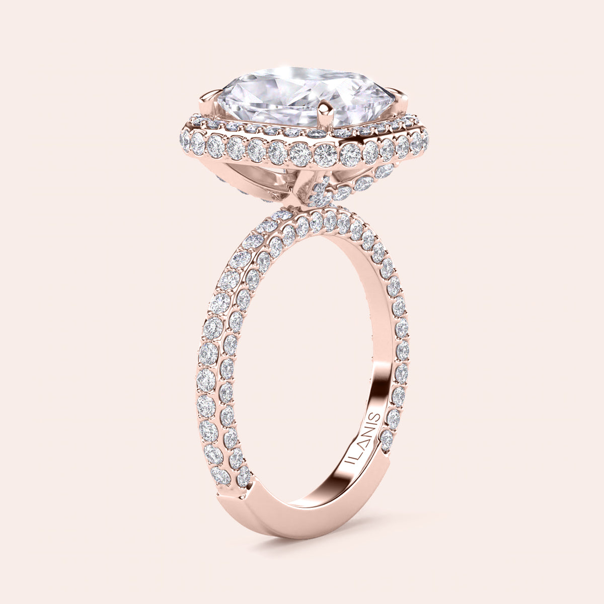 Rose gold teardrop halo engagement ring set featuring pear-shaped diamond, with options in 14K, 18K, or platinum settings.
