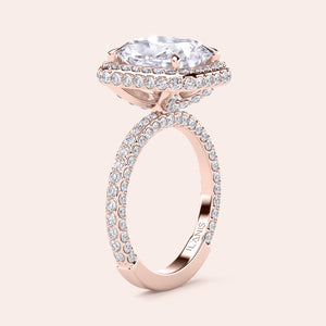 Rose gold teardrop halo engagement ring set featuring pear-shaped diamond, with options in 14K, 18K, or platinum settings.