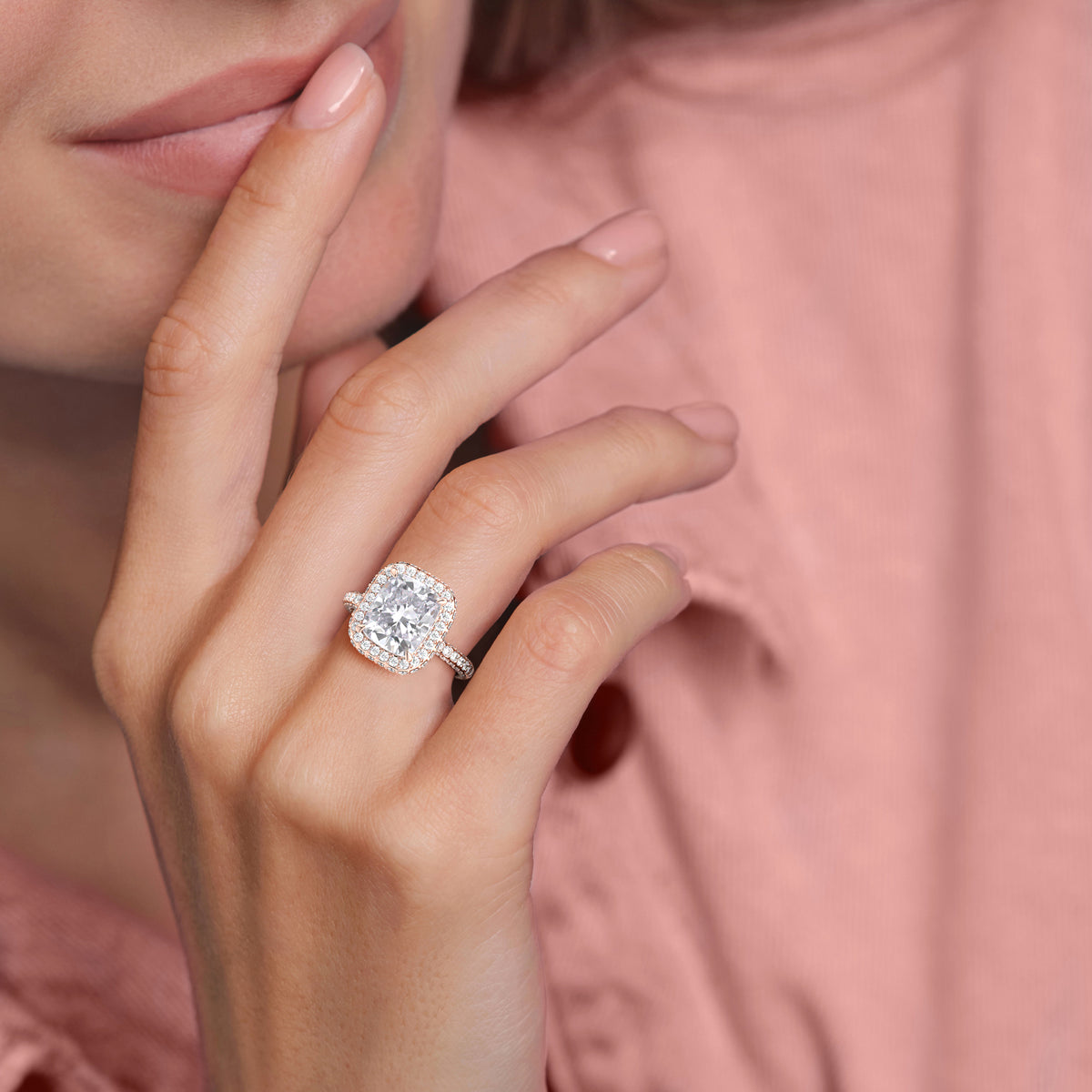 Rose gold teardrop halo engagement ring set featuring pear-shaped diamond, with options in 14K, 18K, or platinum settings.