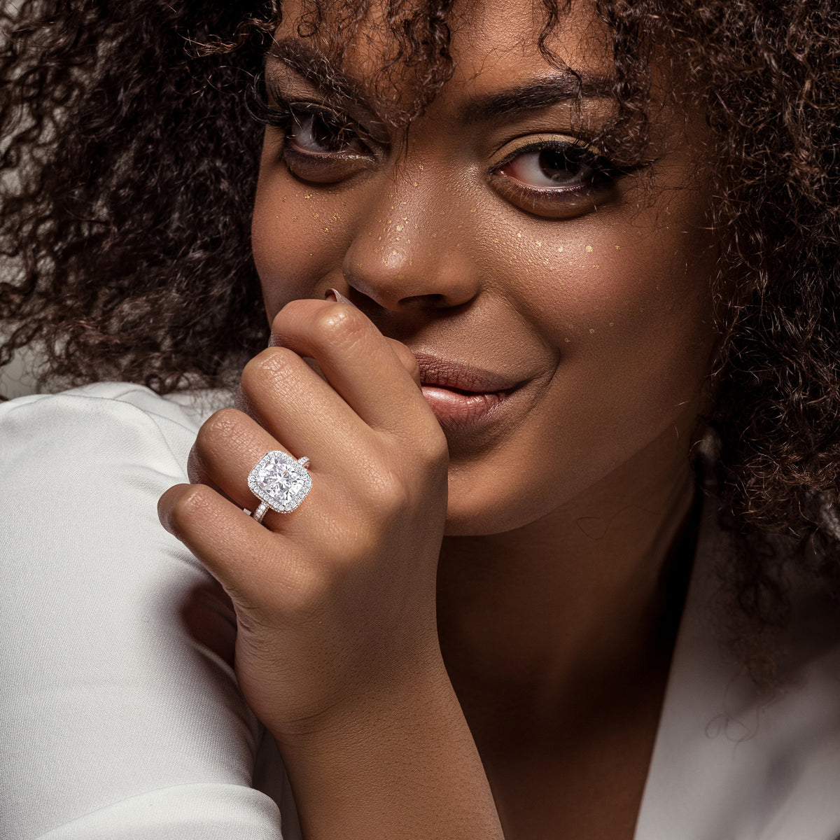 Radiant cut diamond engagement ring in 14K or 18K white gold or platinum with Pave diamond band, front view.