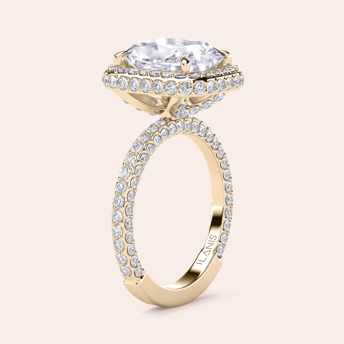 Radiant-cut diamond engagement ring with side stone accents in 14K yellow gold, displayed on a neutral background.
