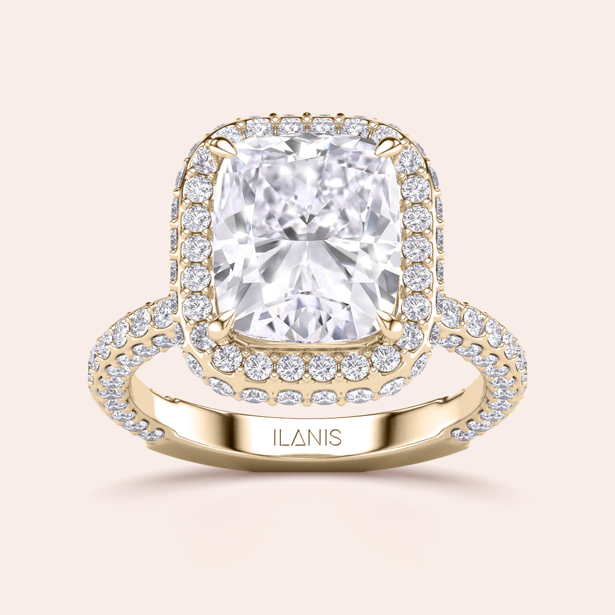 Radiant-cut diamond engagement ring with side stone accents in 14K yellow gold, displayed on a neutral background.