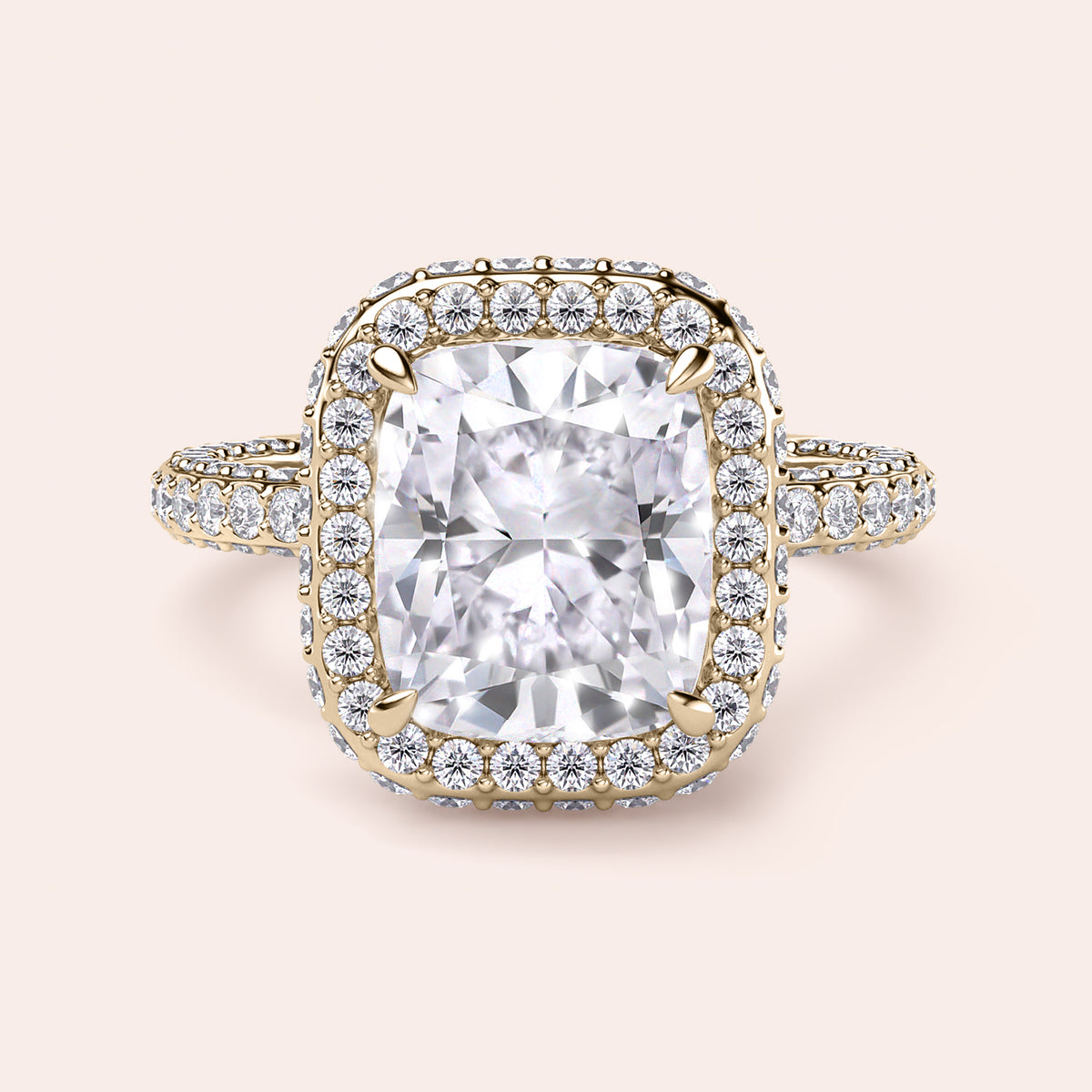 Radiant-cut diamond engagement ring with side stone accents in 14K yellow gold, displayed on a neutral background.
