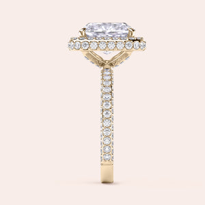 Radiant-cut diamond engagement ring with side stone accents in 14K yellow gold, displayed on a neutral background.