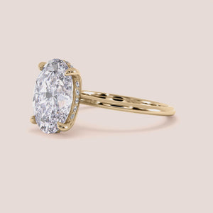 Elegant oval diamond engagement ring in polished 14K gold, luxurious 18K gold, or premium platinum, showcasing a stunning solitaire design.
