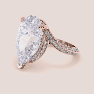 Rose gold 14K pear engagement ring with hidden halo accents and 3D pave design, perfect for a unique proposal or special occasion.