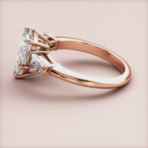 Rose gold engagement ring featuring a trillion-cut diamond center and tapered baguette diamonds, available in 14K, 18K, or platinum.
