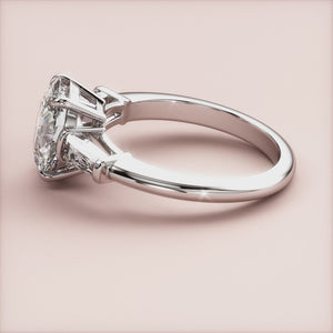 Elegant oval-shaped diamond engagement ring in 14K/18K white gold or platinum with tapered baguette diamonds for added brilliance.