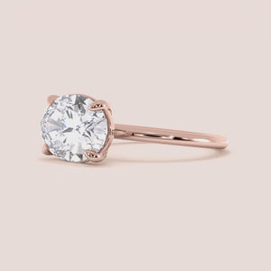 "Rose Gold 14K East-West Oval Solitaire Engagement Ring; elegant design perfect for love and commitment.