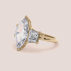 """14K Yellow Gold marquise three stone trapezoid jade engagement ring, a stunning blend of elegance and craftsmanship.""