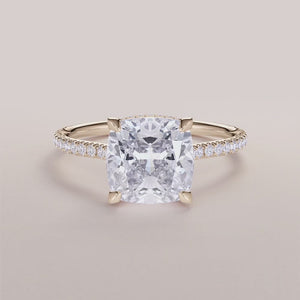 Elegant 14K or 18K gold cushion-cut diamond engagement ring with a hidden halo and shimmering pave band.