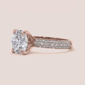"Beautiful rose gold engagement ring with a stunning round three-rowPave setting, available in 14K, 18K, or platinum."