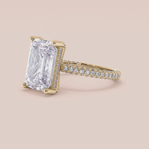 "14K yellow gold Emery pear engagement ring with hidden halo accents and 3D pave prongs, perfect for timeless elegance.