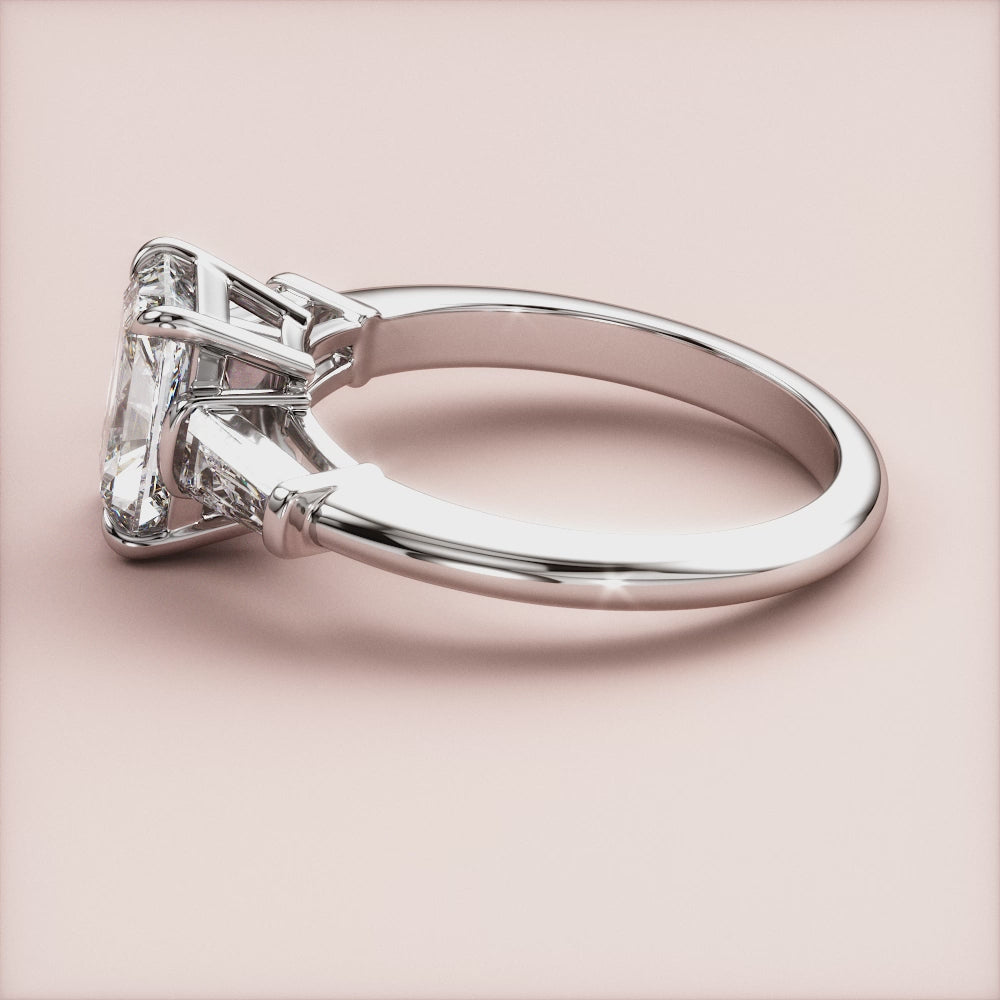 "Radiant 3-stone tapered baguette engagement ring in 14K white gold, a stunning symbol of love and elegance.|

#14KRecycledWhiteGold
#18KRecycledWhiteGold








#Platinum"
