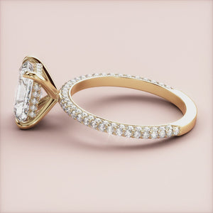 Elegant oval-cut diamond engagement ring in 14K yellow gold with a sparkling halo and pave band, perfect for special moments.