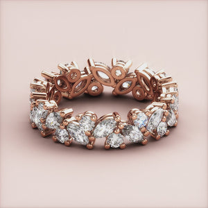 Elegant 14K/18K rose gold eternity wedding band with marquise-cut diamonds in a luxurious pattern for a stunning look. 
