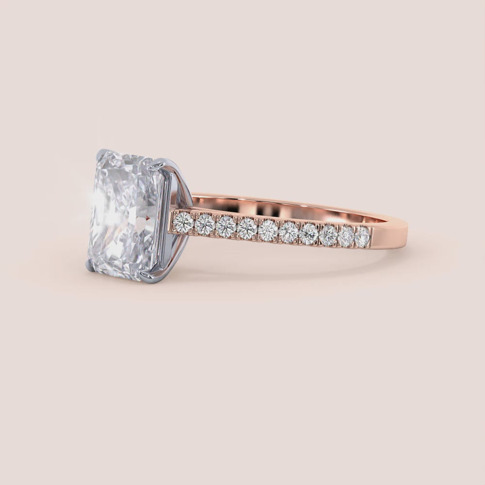 Two-tone 14K rose and white gold diamond engagement ring with radiant-cut stone and pave diamond band, elegant cathedral setting. |
#14KRecycledRose/WhiteGold
#18KRecycledRose/WhiteGold