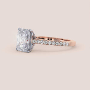 Two-tone 14K rose and white gold diamond engagement ring with radiant-cut stone and pave diamond band, elegant cathedral setting. 