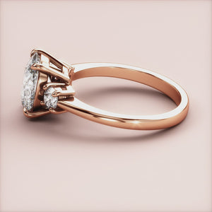 "Rose Gold 14K Vesta oval three-stone round engagement ring, featuring exquisite design and sparkle, perfect for a romantic proposal.