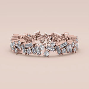 14K rose gold wedding band with an intricate design of sparkling baguette and round diamonds, offering luxurious elegance. 