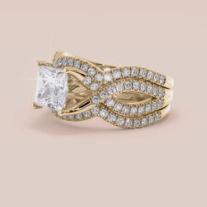 "14K yellow gold Myla ring set with princess cut diamonds in a twisted pave band, perfect for engagement and special occasions.