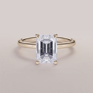 Elegant 14K yellow gold solitaire engagement ring with marquise-cut diamond, perfect for timeless romance.