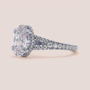"Elegant 14K white gold engagement ring with a single oval split shank and hidden halo, perfect for modern romance.
