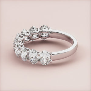 Elegant 14K-18K or platinum oval half-eternity wedding band with round brilliant-cut diamonds, perfect for special occasions. 