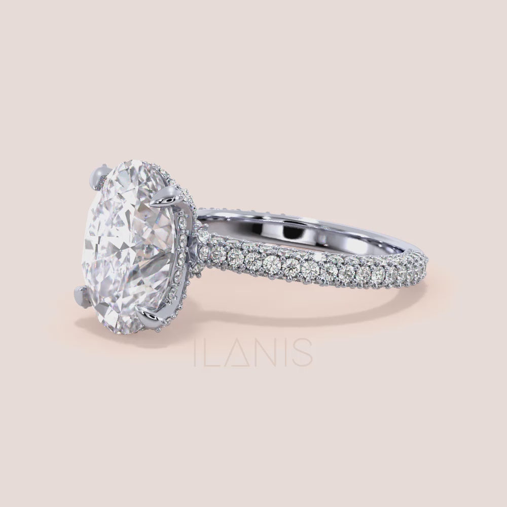 Oval cut diamond ring in white gold with pavé band and hidden halo, close-up video highlighting fire, brilliance and fine diamond details | #14KRecycledWhiteGold #18KRecycledWhiteGold #Platinum