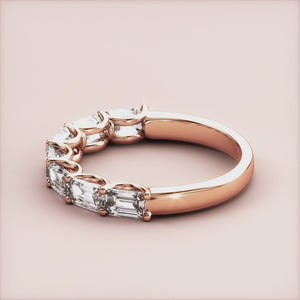 Elegant rose gold eternity band with radiant-cut diamonds, available in 14K, 18K, or platinum settings. Perfect wedding band choice. 