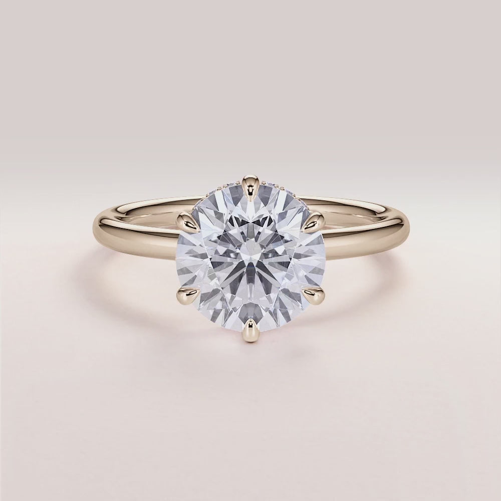 Elegant round diamond engagement ring in 14K yellow gold, featuring a hidden halo design and a sleek plain band.|




#14KRecycledYellowGold
#18KRecycledYellowGold




