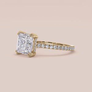 "Yellow Gold 14K & 18K engagement ring featuring a princess cut with invisible gallery, hidden halo, and pave band.