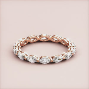 Elegant marquise eternity wedding band with diamonds in 14K/18K rose gold, showcasing a timeless design. 