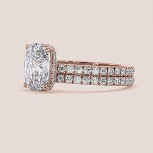 Stunning 14K or 18K rose gold engagement ring with a radiant oval diamond andPave halo, exuding timeless luxury.
