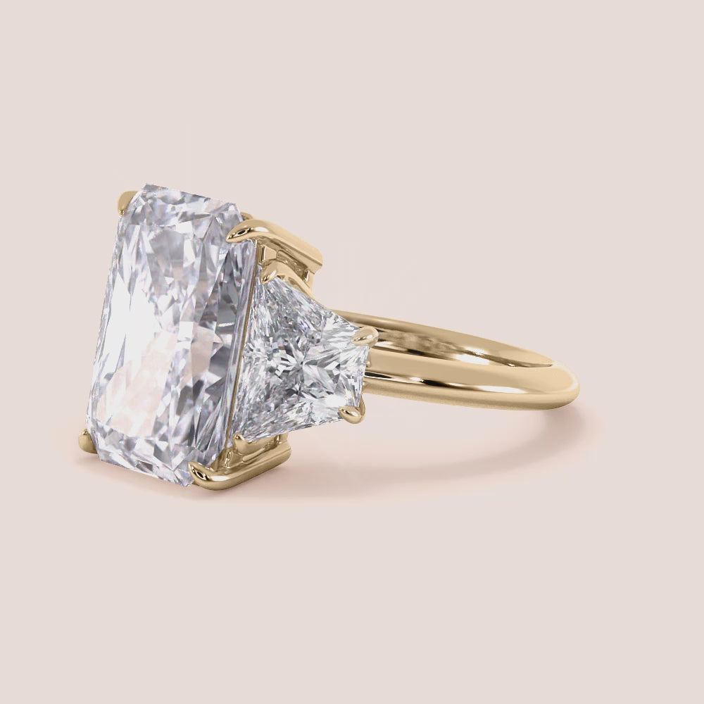 "Elegant 14K yellow gold engagement ring featuring emerald and three tapered baguette stones for a stunning vintage-inspired look.|




#14KRecycledYellowGold
#18KRecycledYellowGold





"




#14KRecycledYellowGold
#18KRecycledYellowGold





"
