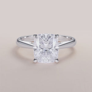 "White gold solitaire marquise diamond engagement ring in 14K, 18K, or platinum, featuring classic prong setting and timeless elegance."