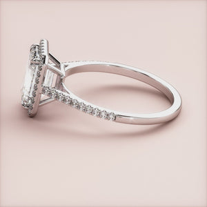 Stunning halo engagement ring with emerald-cut diamond and micropavÃ© band, available in 14K or 18K gold or platinum.