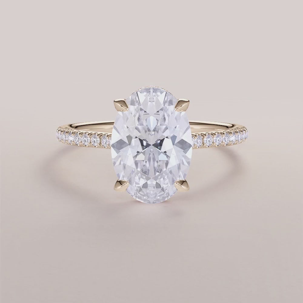 Yellow Gold 14K & 18K oval engagement ring with invisible gallery, hidden halo, and pave band - exquisite craftsmanship and elegance.|







#14KRecycledYellowGold
#18KRecycledYellowGold



