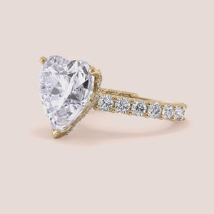 "Yellow gold 14K engagement ring featuring a heart-shaped hidden halo and diamond accents, perfect for an elegant proposal.