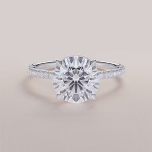 Elegant 14K white gold engagement ring with marquise diamond andPave band. Available in 18K or platinum. Not worn on model.
