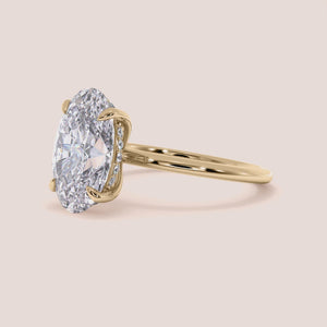 "Elegant 14K Yellow Gold oval solitaire engagement ring with plain shank and hidden halo, perfect for timeless romance.