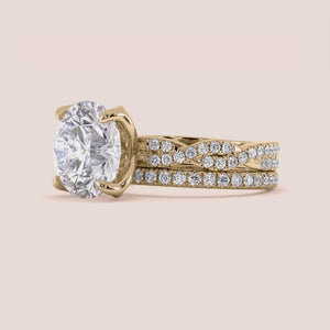 Radiant-cut diamond engagement ring with side stone accents in 14K yellow gold, displayed on a neutral background.
