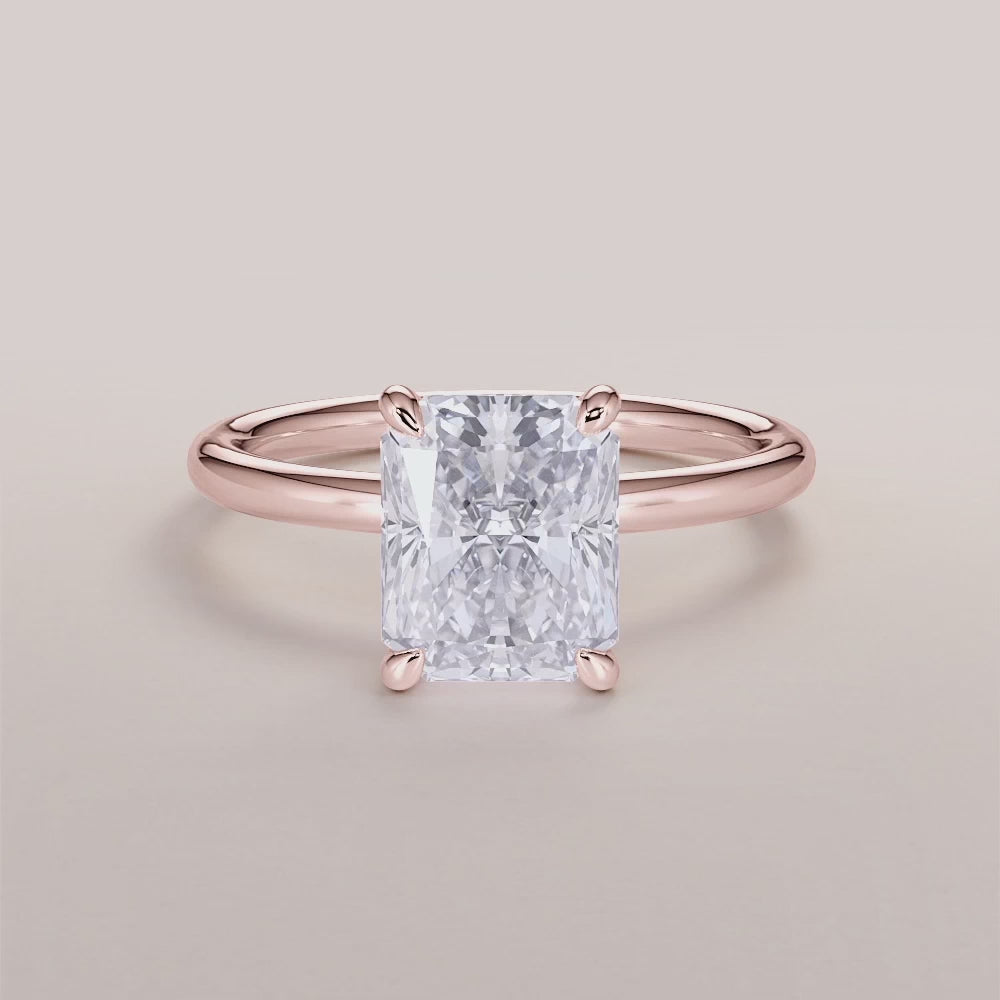 "Rose Gold 14K and 18K radiant classic solitaire engagement ring, featuring a stunning timeless design, perfect for proposals.|







#14KRecycledRoseGold
#18KRecycledRoseGold


"
