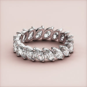 Elegant white gold marquise eternity wedding band featuring diamonds, available in 14K, 18K, or platinum. 