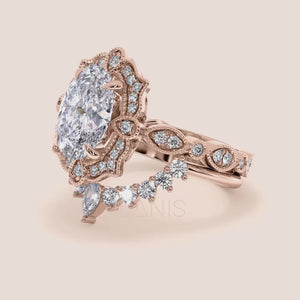 Detailed video of oval halo diamond engagement ring set, highlighting exquisite craftsmanship and filigree accents in recycled rose gold 