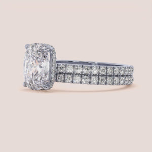 Elegant 14K and 18K gold or platinum engagement ring with a stunning oval diamond and smaller diamonds adorning the band.