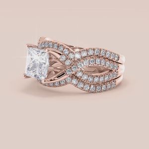 "14K rose gold Myla ring set with princess cut stones and twisted pave band, perfect for engagement or special occasions.