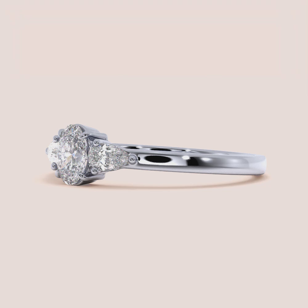 """14K White Gold Oval Small Three Stone Engagement Ring with Pear Side Stones â€“ Elegant and Timeless Design""|

#14KRecycledWhiteGold
#18KRecycledWhiteGold








#Platinum"
